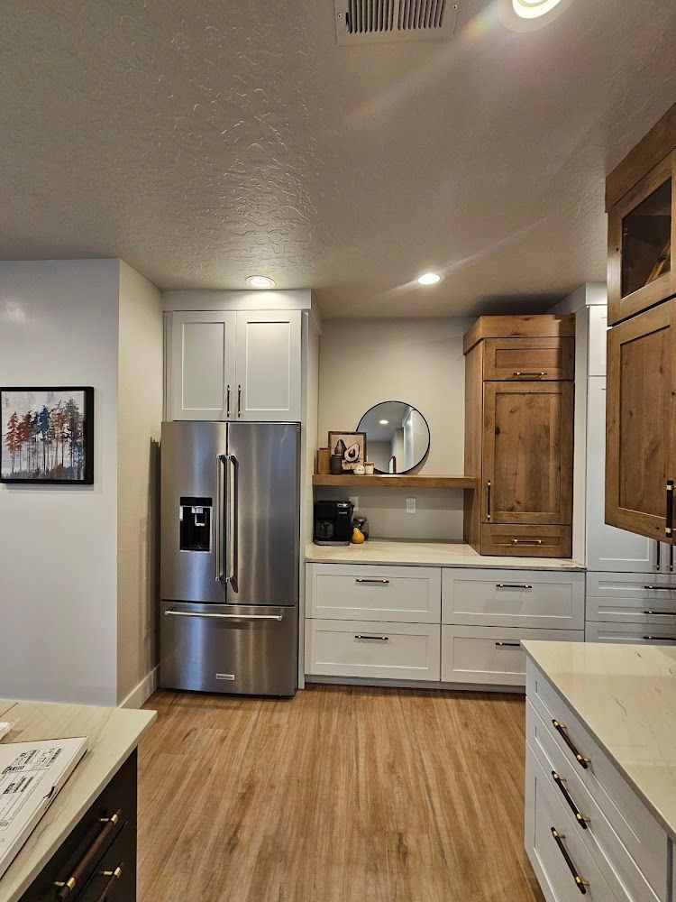 A kitchen with stainless steel appliances and wooden cabinets