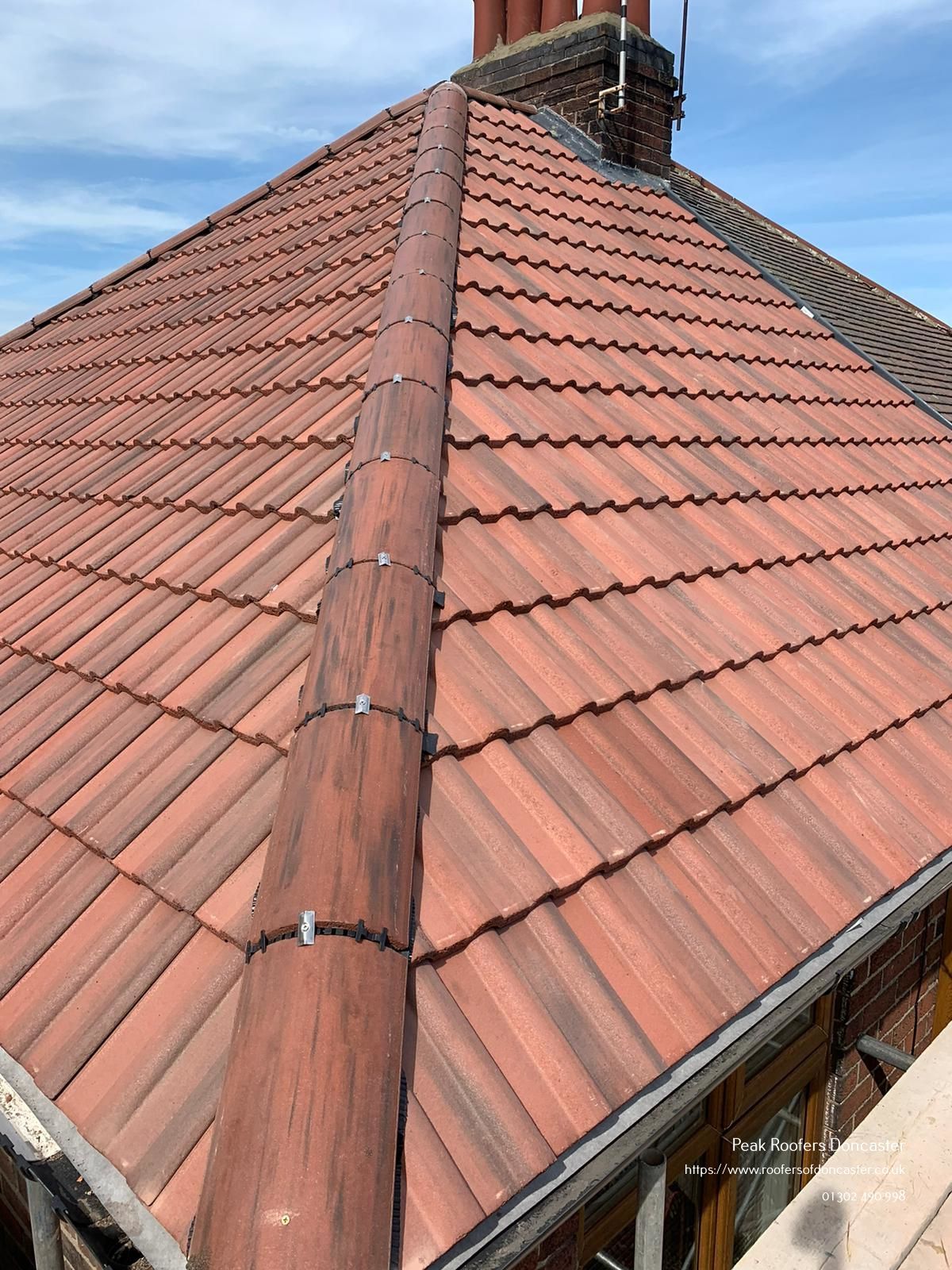 New hipped roof in english red concrete tiles by roofers doncaster