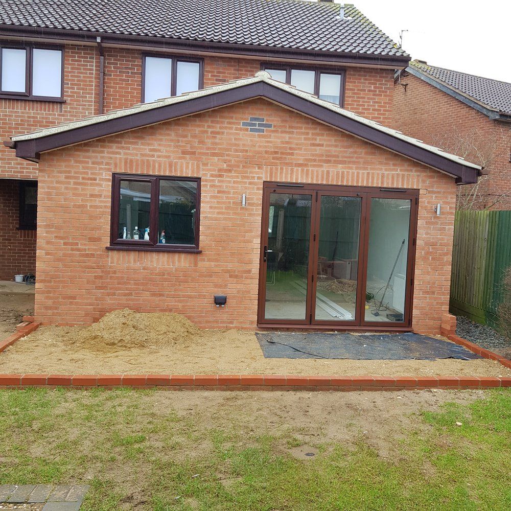 Large single storey extension on back of house with patio doors