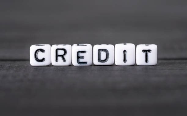 The word credit is written in white blocks on a black surface.