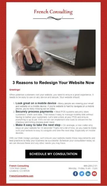 A person is using a laptop computer with a mouse.