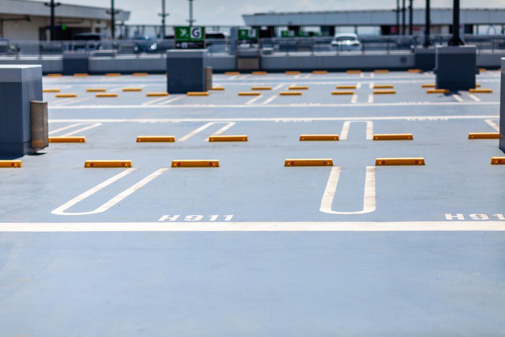A Parking Garage with A Lot of Parking Spaces and Yellow Barriers — Top End Line Markers Pty Ltd in Katherine, NT
