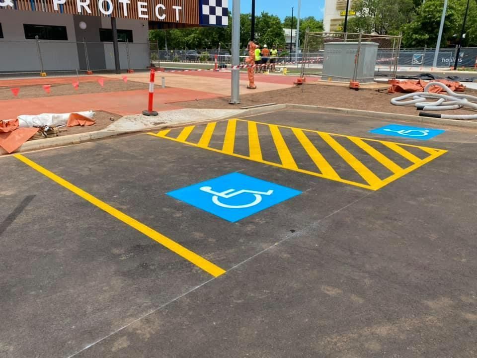 A Handicapped Parking Spot Is Painted on The Side of The Road — Top End Line Markers Pty Ltd in Katherine, NT