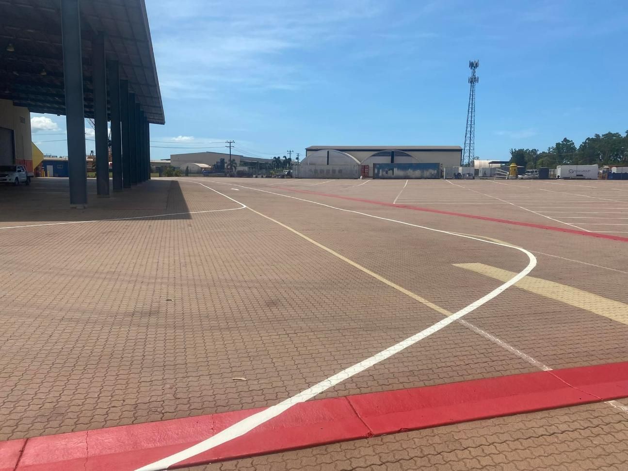A Red and White Line on A Brick Road — Top End Line Markers Pty Ltd in Katherine, NT