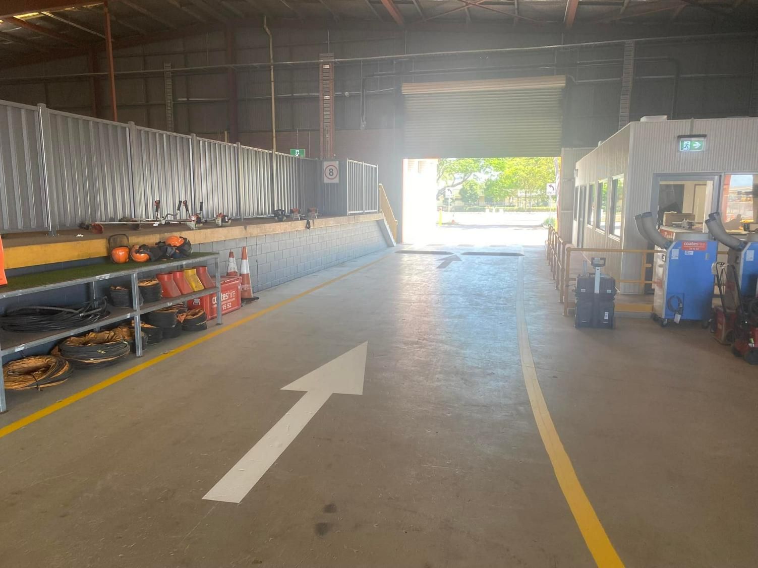 A Warehouse with A White Arrow Pointing to The Right — Top End Line Markers Pty Ltd in Katherine, NT