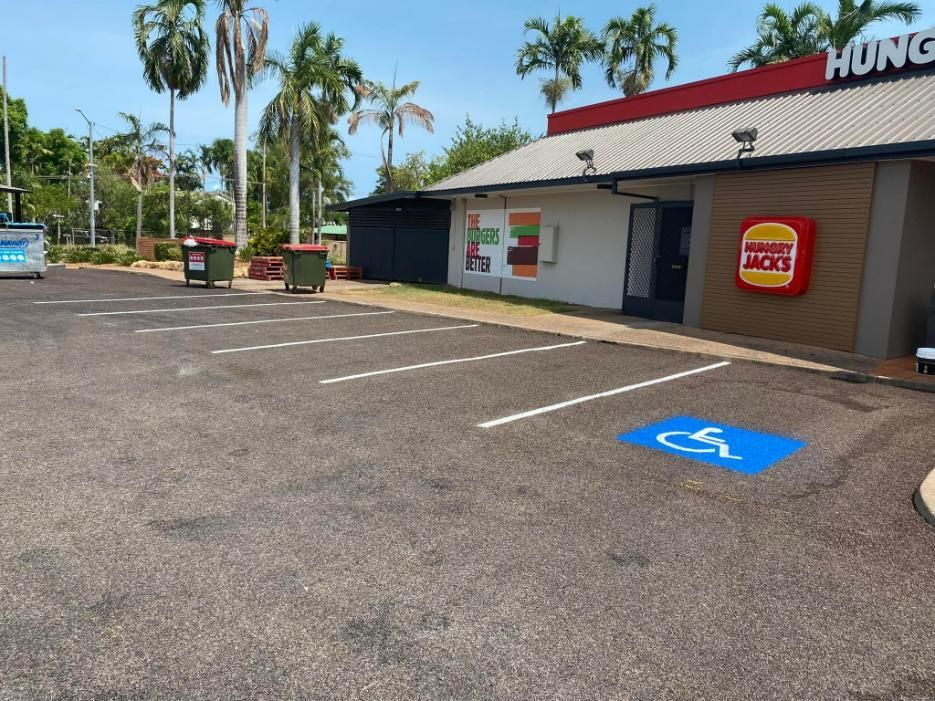A Handicapped Parking Spot Is Painted in Front of A Burger King Restaurant — Top End Line Markers Pty Ltd in Katherine, NT