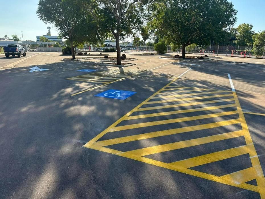 A Parking Lot with A Handicapped Parking Spot Painted on The Road — Top End Line Markers Pty Ltd in Katherine, NT