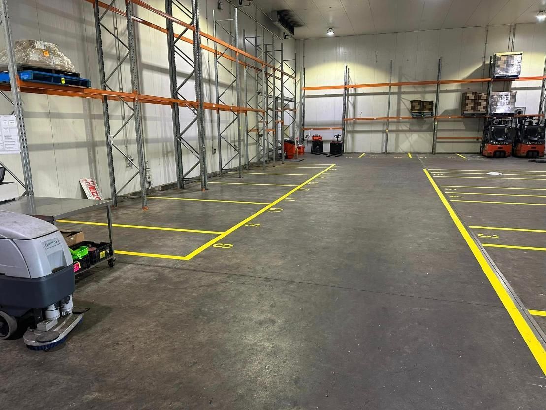 A Warehouse with A Lot of Shelves and A Yellow Line on The Floor — Top End Line Markers Pty Ltd in Jabiru, NT