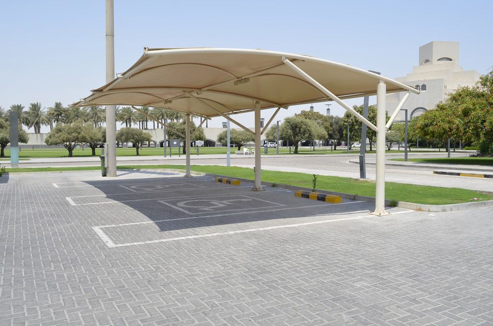 A Parking Lot with A Large Umbrella Over It — Top End Line Markers Pty Ltd in Jabiru, NT