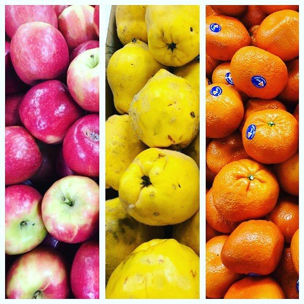 A grocery store aisle filled with fruits and vegetables.
