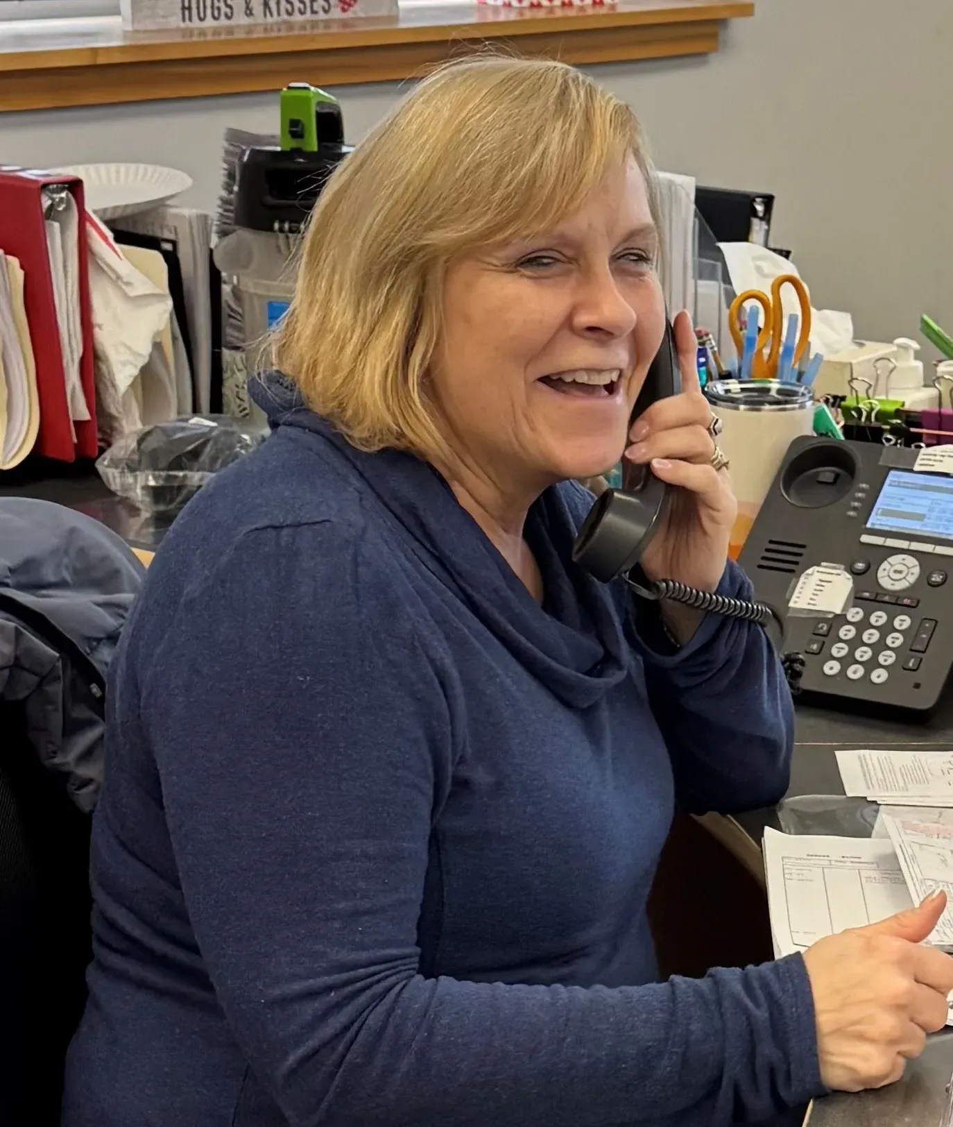 A purple drop of water with a white outline on a white background.