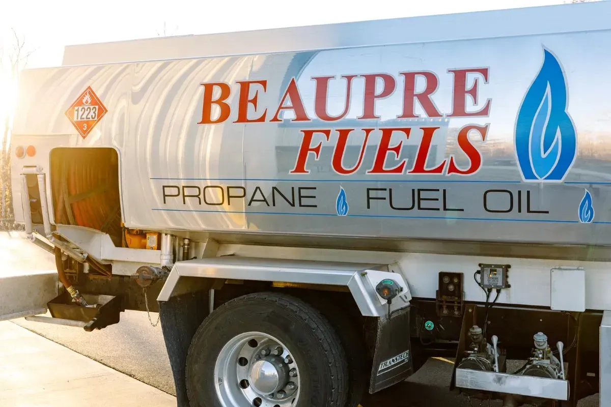 A beaupre fuels propane and fuel oil truck is parked on the side of the road