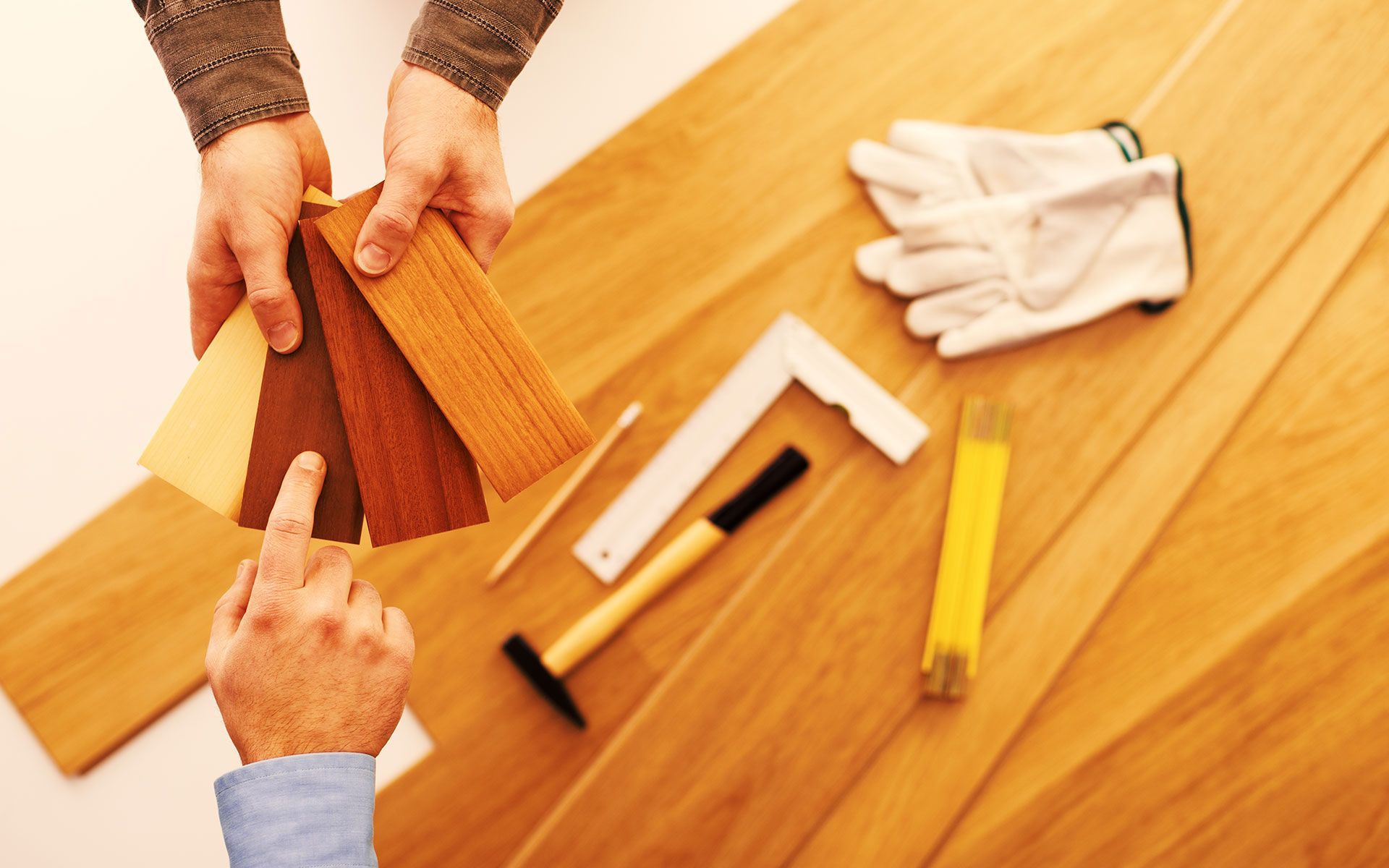 Two people are looking at different types of wood