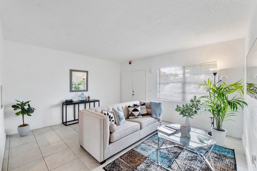 A living room filled with furniture and a flat screen tv.