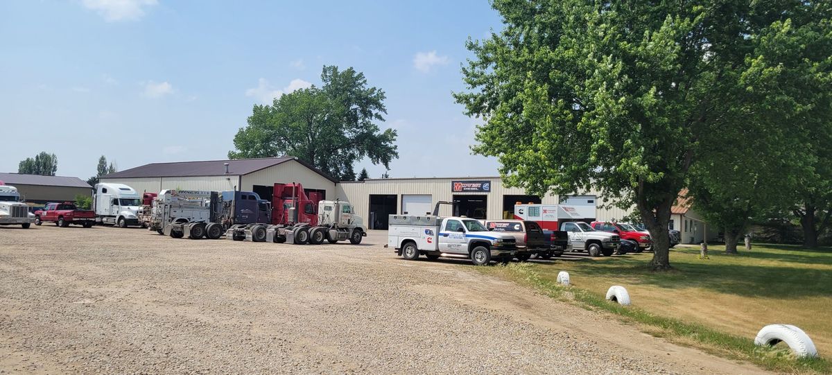 Vehicles Parked in Warehouse - Austin, MN - Midwest Diesel Sales & Service, L.L.P.