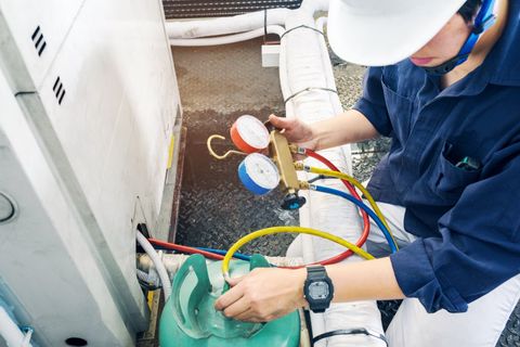 Coolers — Technician Checking Air Conditioner in Louisville, KY