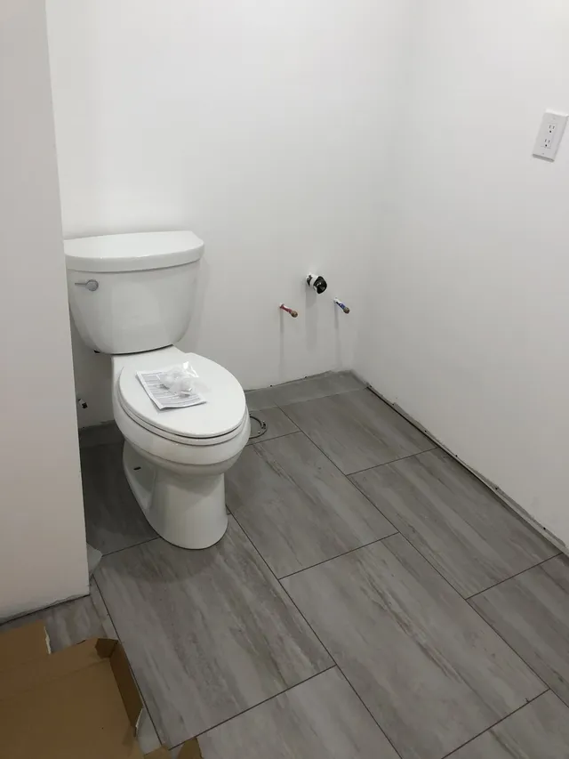 Bathroom with tiled floor — Stroudsburg, PA — Preferred Carpentry LLC