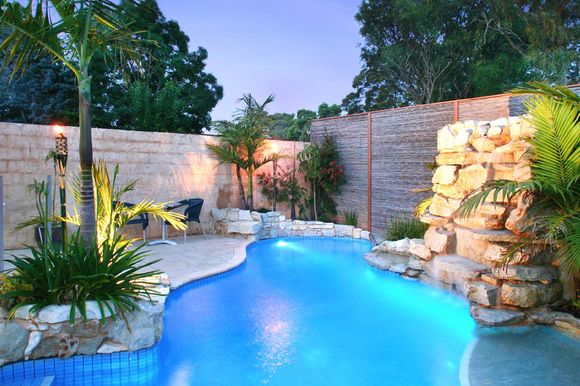 View of the lights around the backyard pool
