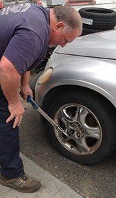 Man Repairing Tire - Tire Repair in Northampton, MA