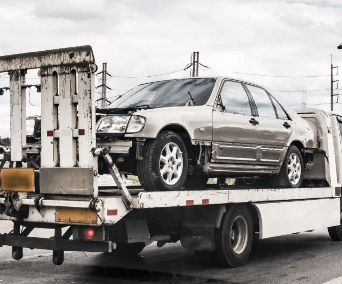 towing company recovering a crashed car in little elm, TX