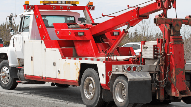 White tow truck servicing the local community