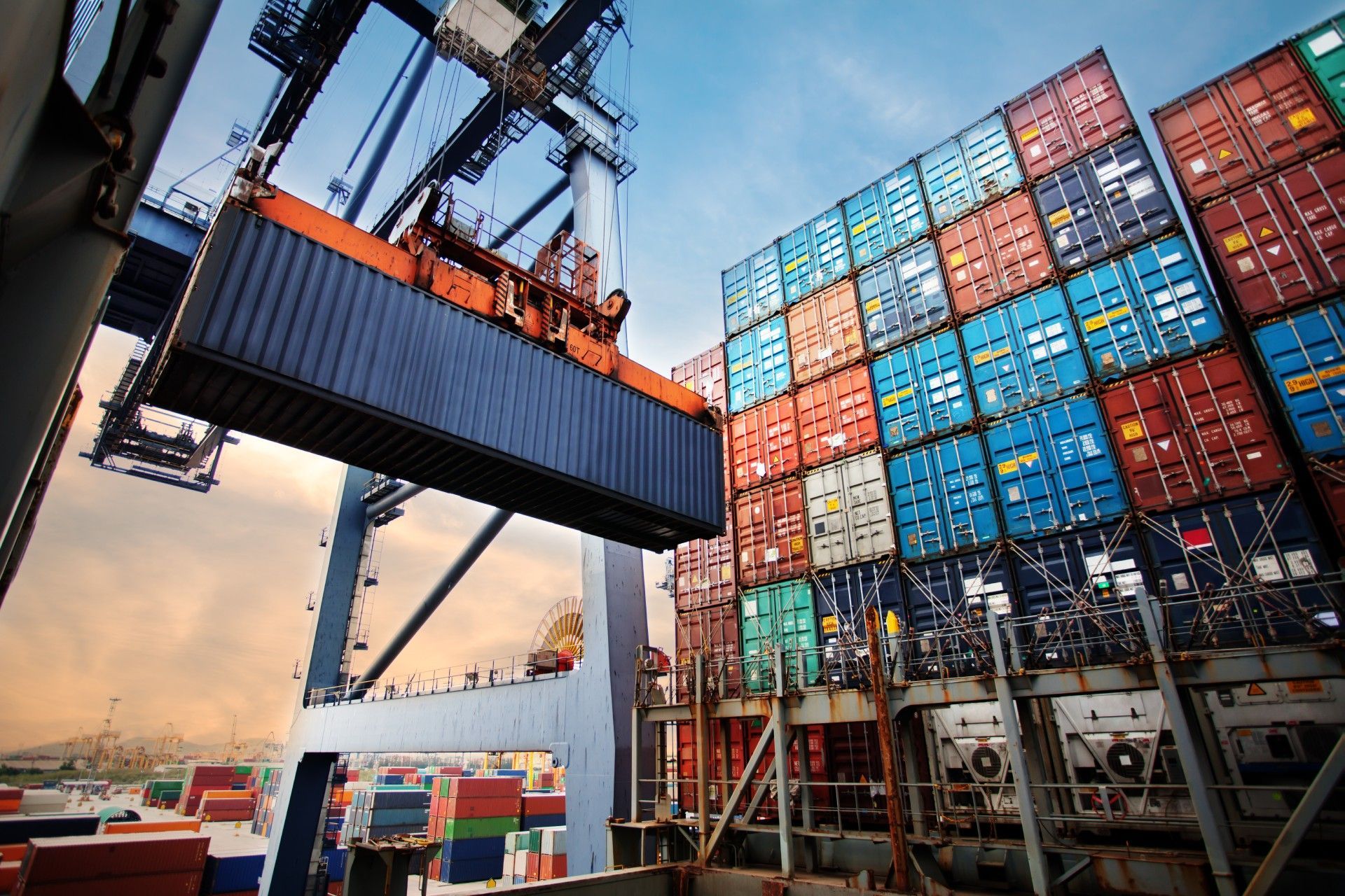 A large container ship is being loaded with cargo.