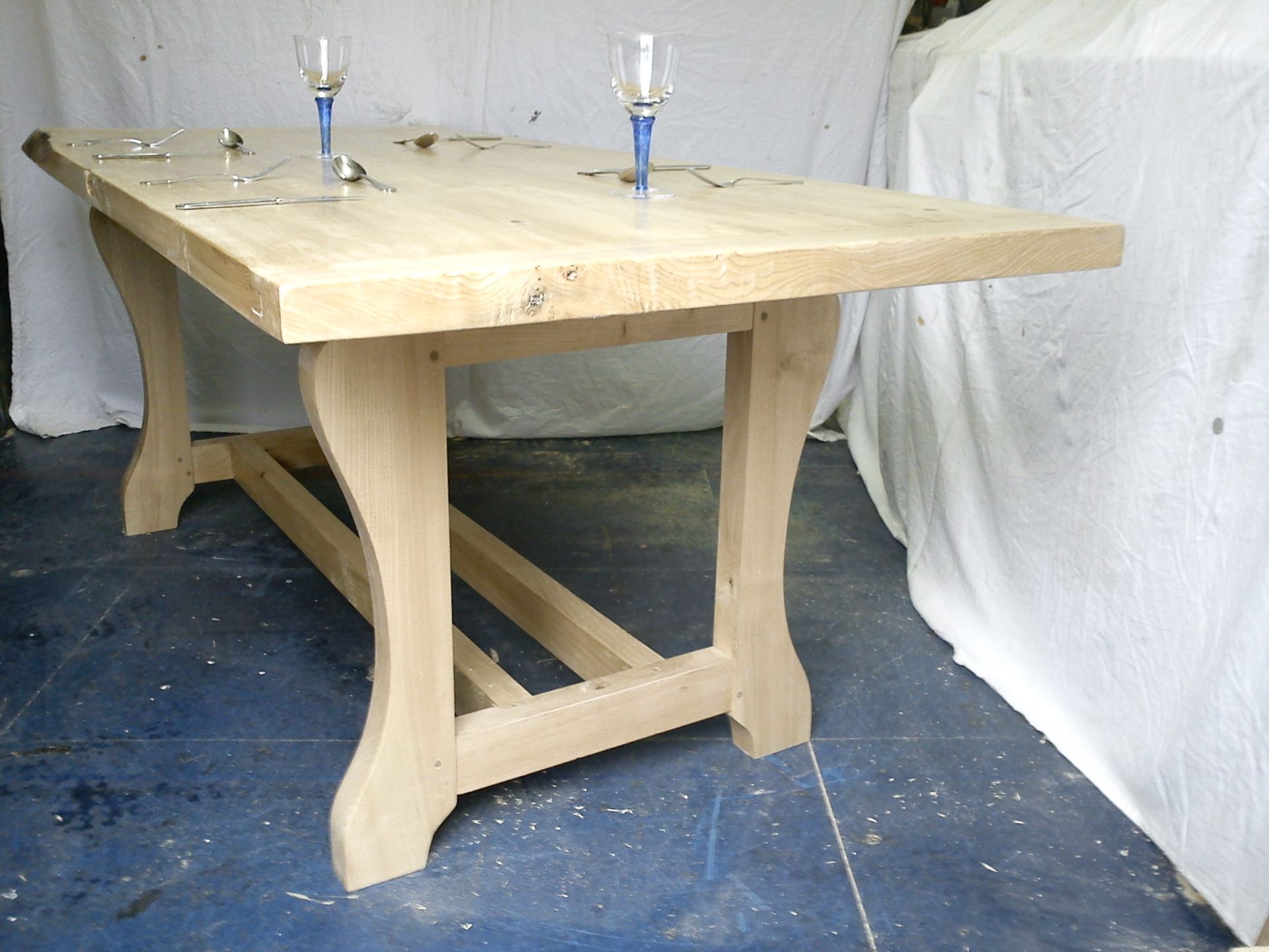 Dining table in Sweet Chestnut image shows legs and base in detail