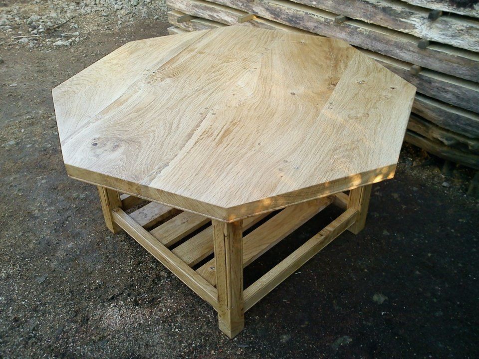 image of a large octagonal coffee table with magazine rack in english oak from sherwood forest made by Patrick Turk the owner of Forest 2 Furniture using timber milled and dried by him