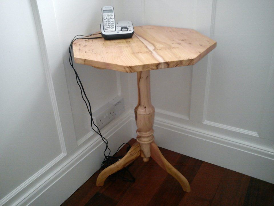 image of an octagonal pedestal table in english yew made by Patrick Turk the owner of Forest 2 Furniture using timber milled and dried by him