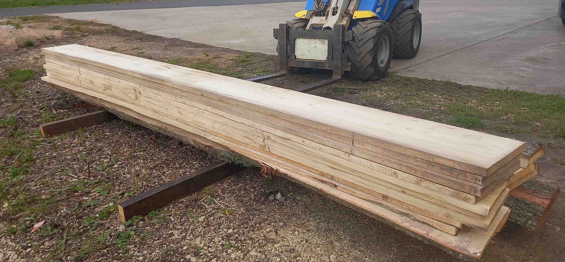 image of oak planks being moved by the multione loader