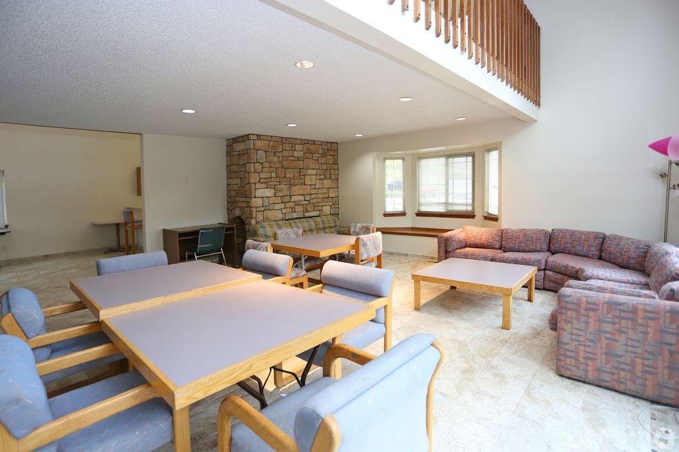 A living room with tables and chairs and a couch