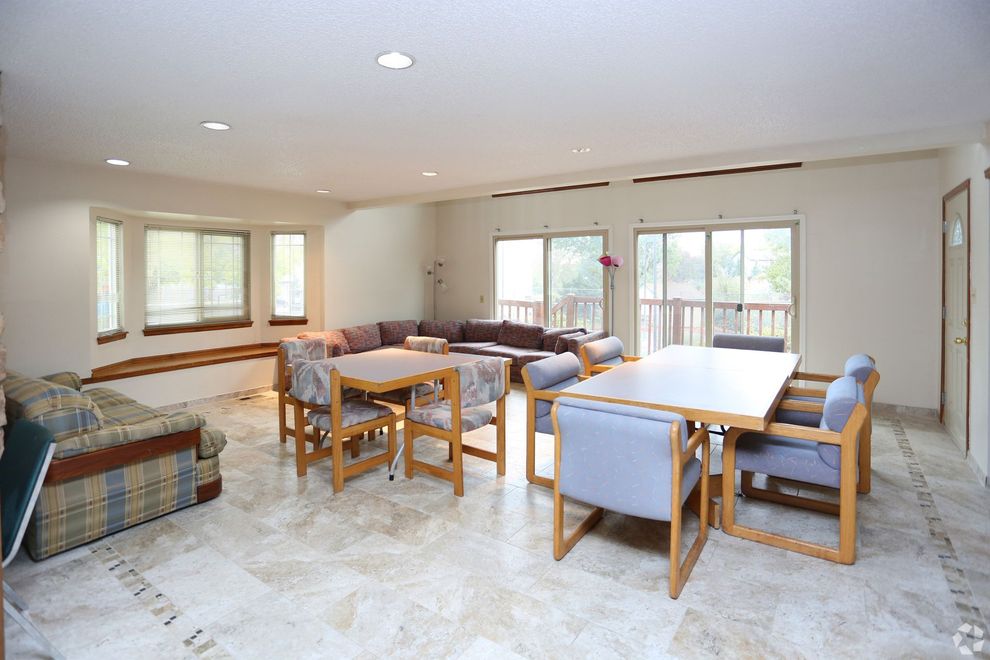 A living room with tables and chairs and a couch