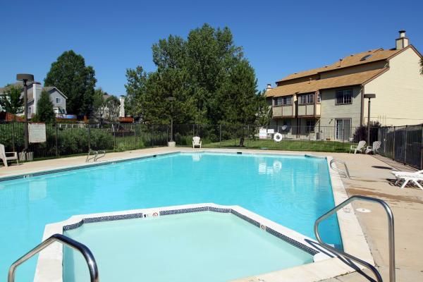 A large swimming pool in front of a building