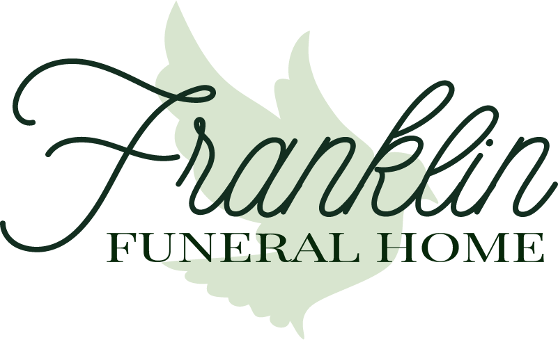 Logo for Franklin Funeral Home, featuring elegant script text and a stylized dove. The text is in dark green.