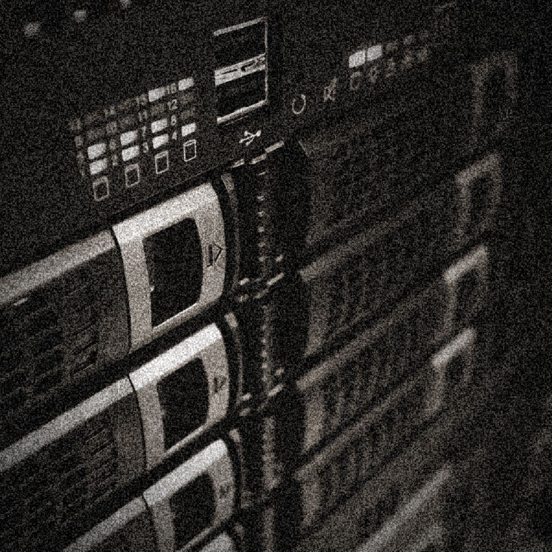 grainy image of a bank of server tapes