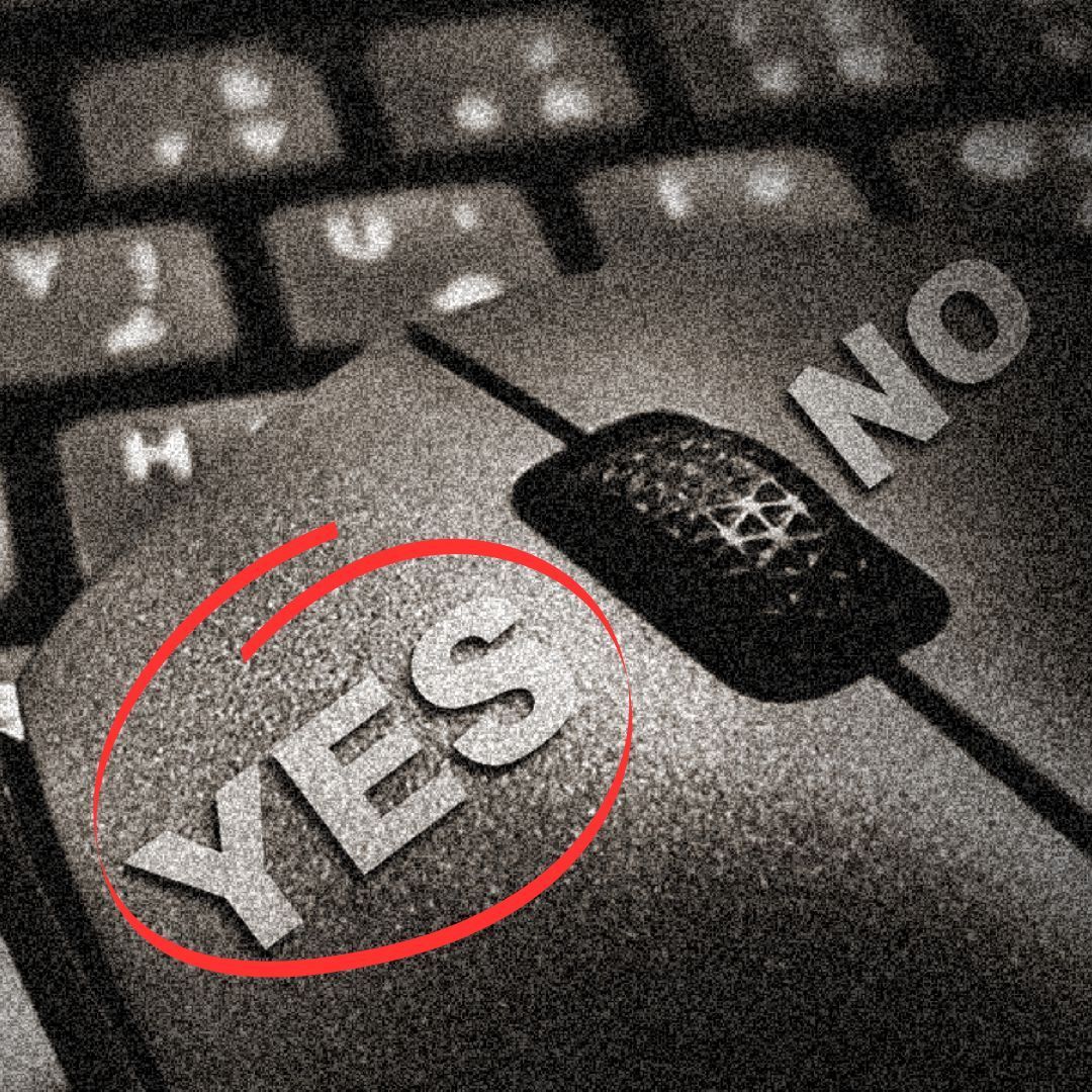 grainy image of a mouse on a keyboard. The  yes left hand button is circled in red