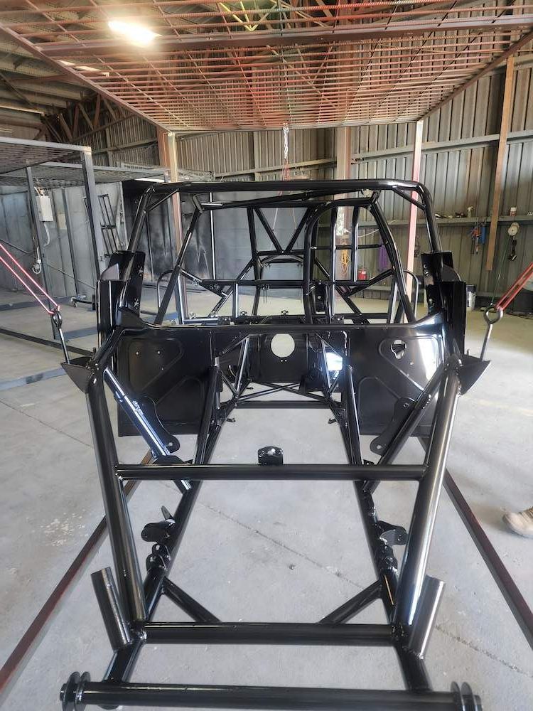 A Car Frame Is Sitting Inside Of A Building — ADK Coatings In Yeppoon, QLD
