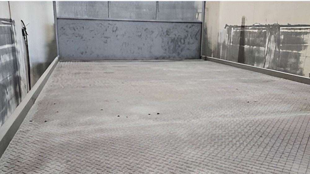 An Empty Room With A Metal Floor And A Wall — ADK Coatings In Toolooa, QLD