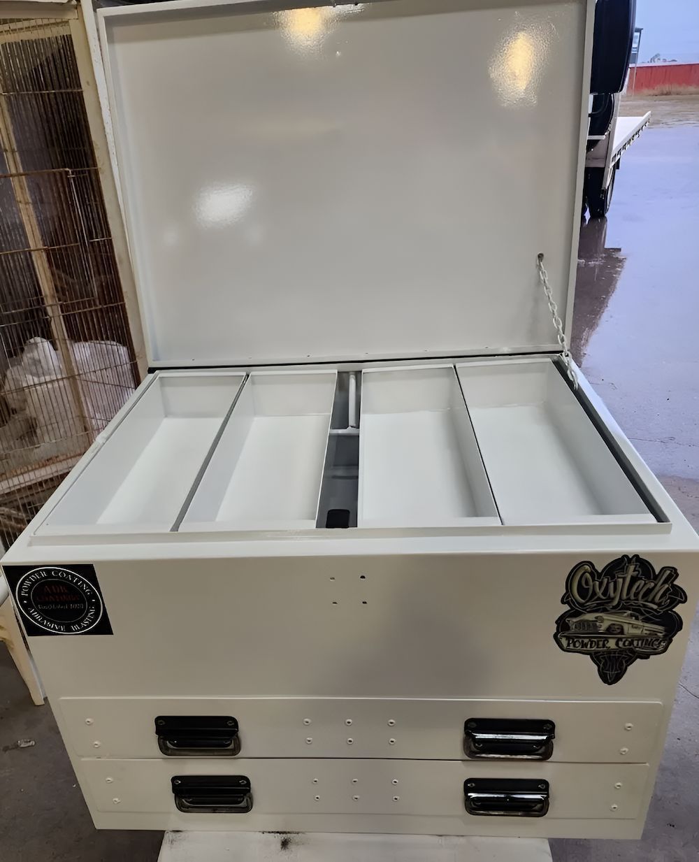 A White Box With The Lid Open Is Sitting On Top Of A Table — ADK Coatings In Toolooa, QLD