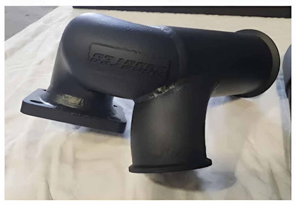 A Black Pipe Is Sitting On A White Cloth On A Table — ADK Coatings In Tannum Sands, QLD