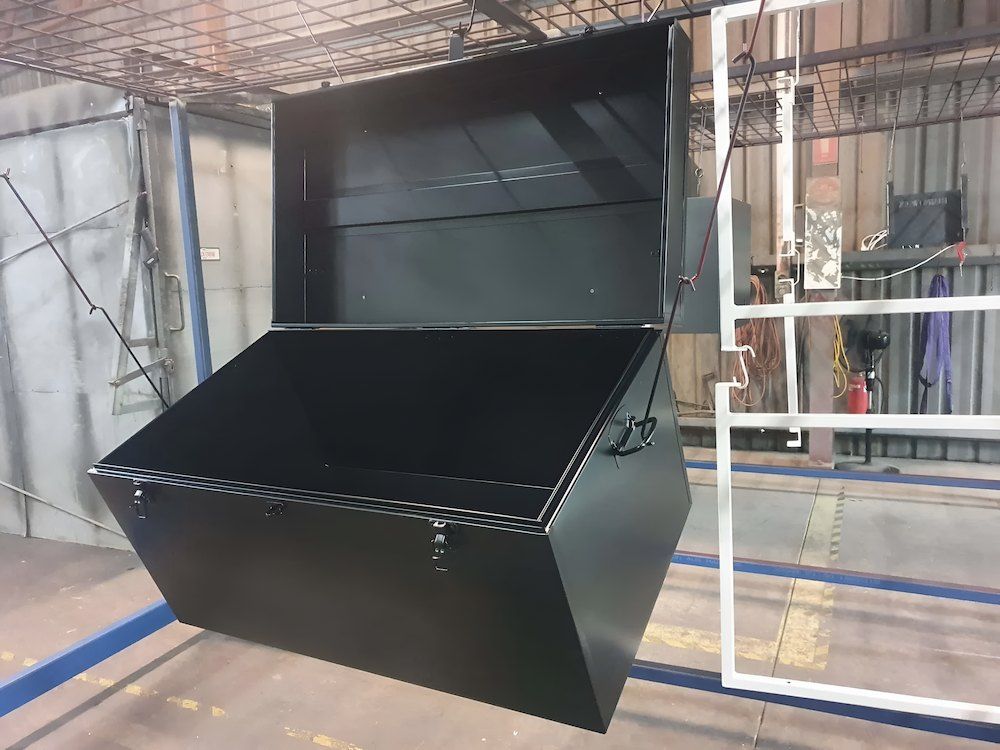 A Black Box Is Hanging From A White Railing In A Room — ADK Coatings In Yeppoon, QLD