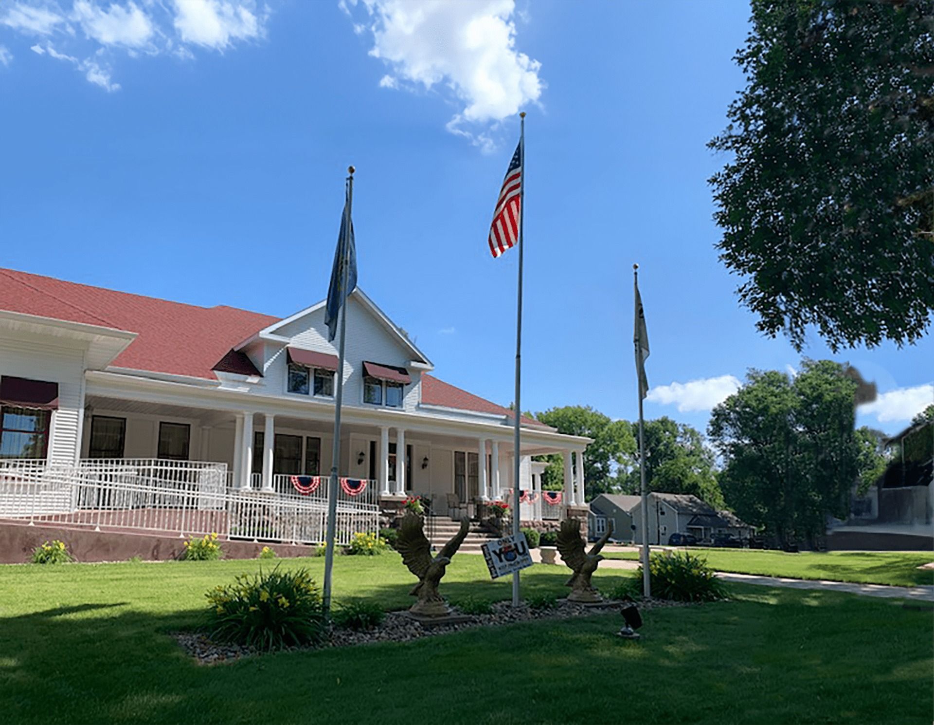 A large office building with a lot of windows on a sunny day.