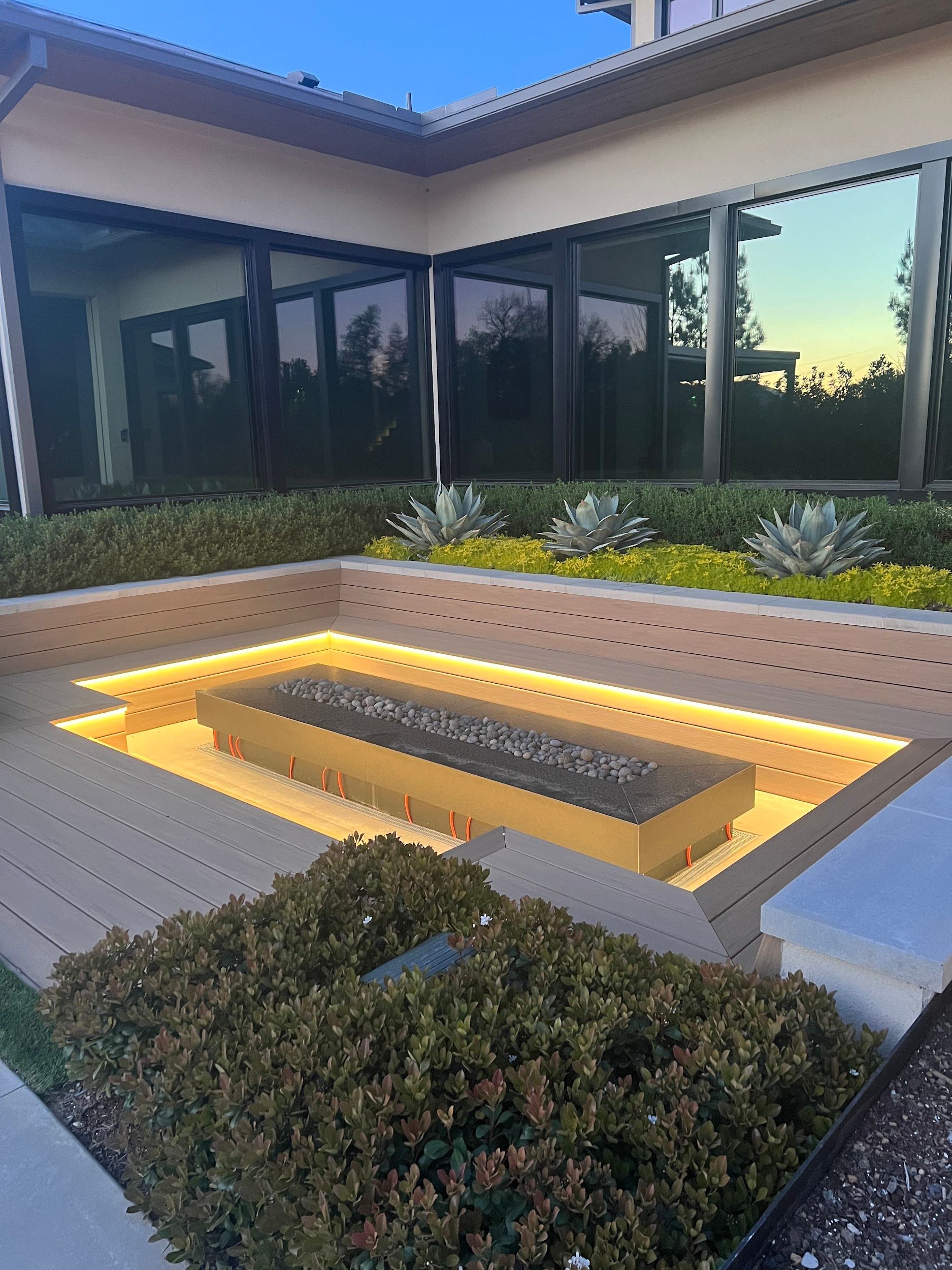 There is a fire pit in the middle of the yard.