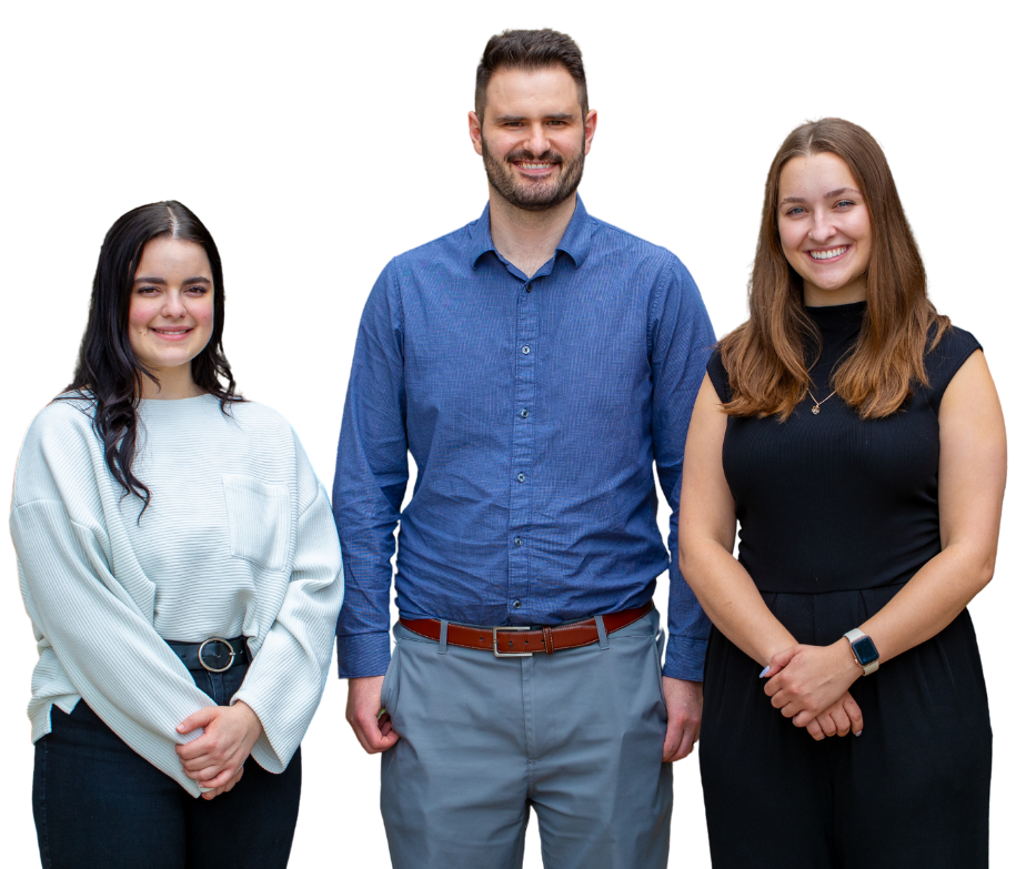 A man and two women are standing next to each other on a white background.