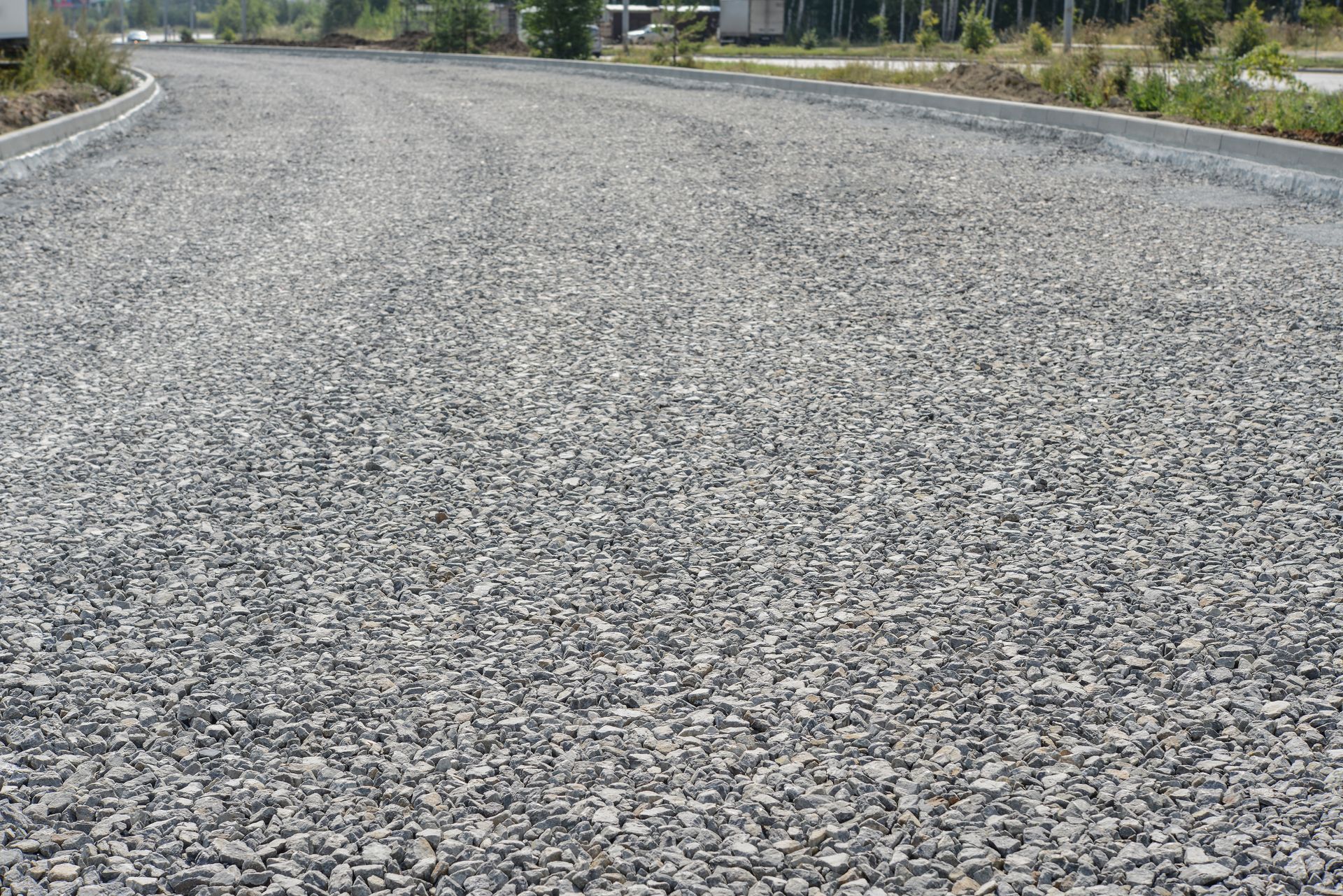 a close up of a gravel road with a lot of gravel on it .