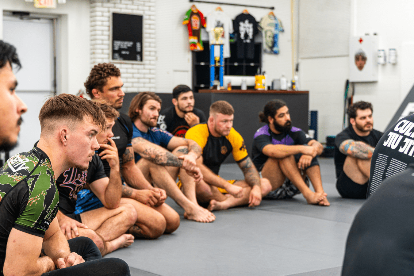 Adults drilling Brazilian Jiu-Jitsu fundamentals at Simple Man Martial Arts in Austin, TX for confidence and fitness.