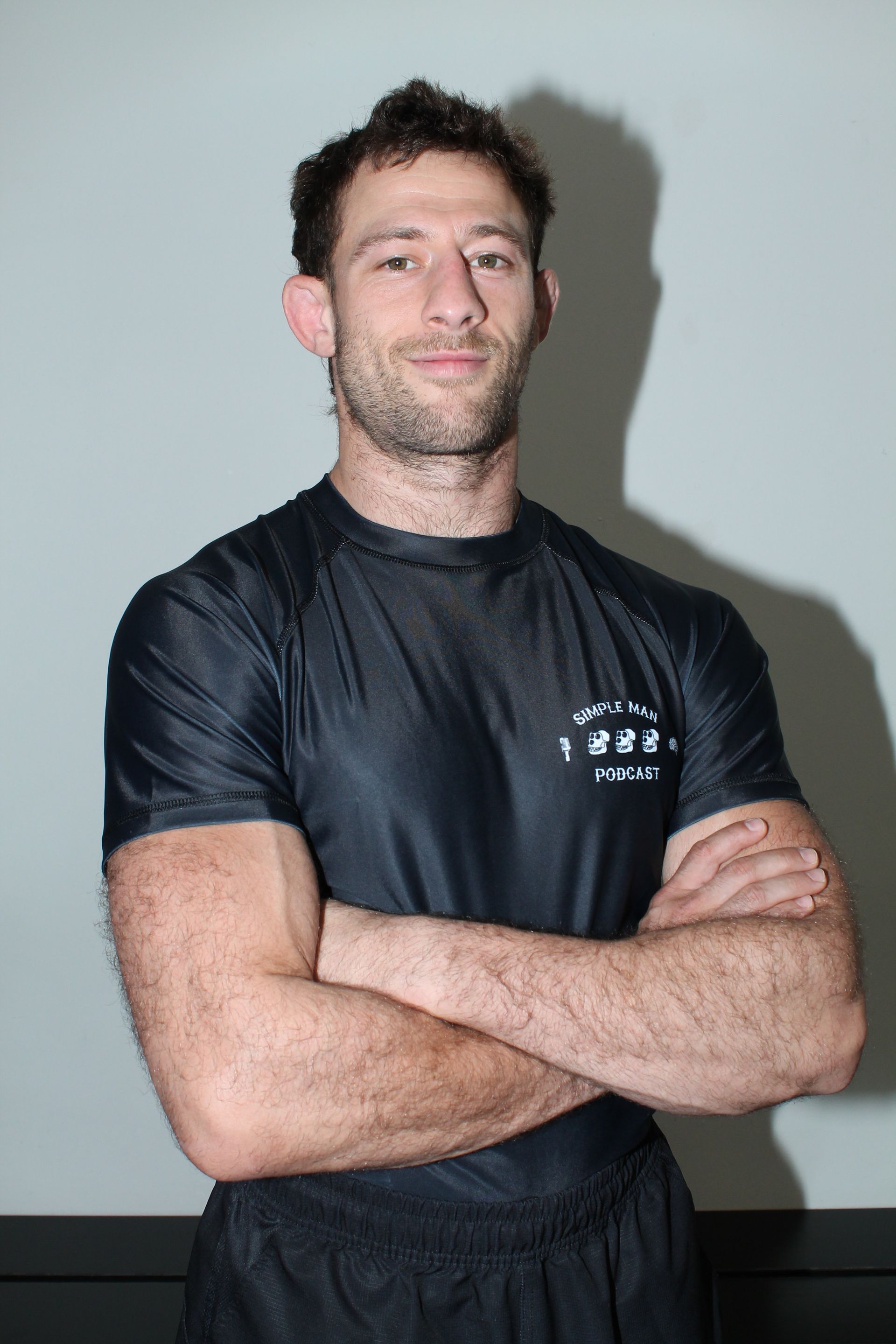 Students practicing Brazilian Jiu-Jitsu at Simple Man Martial Arts in Austin, TX.