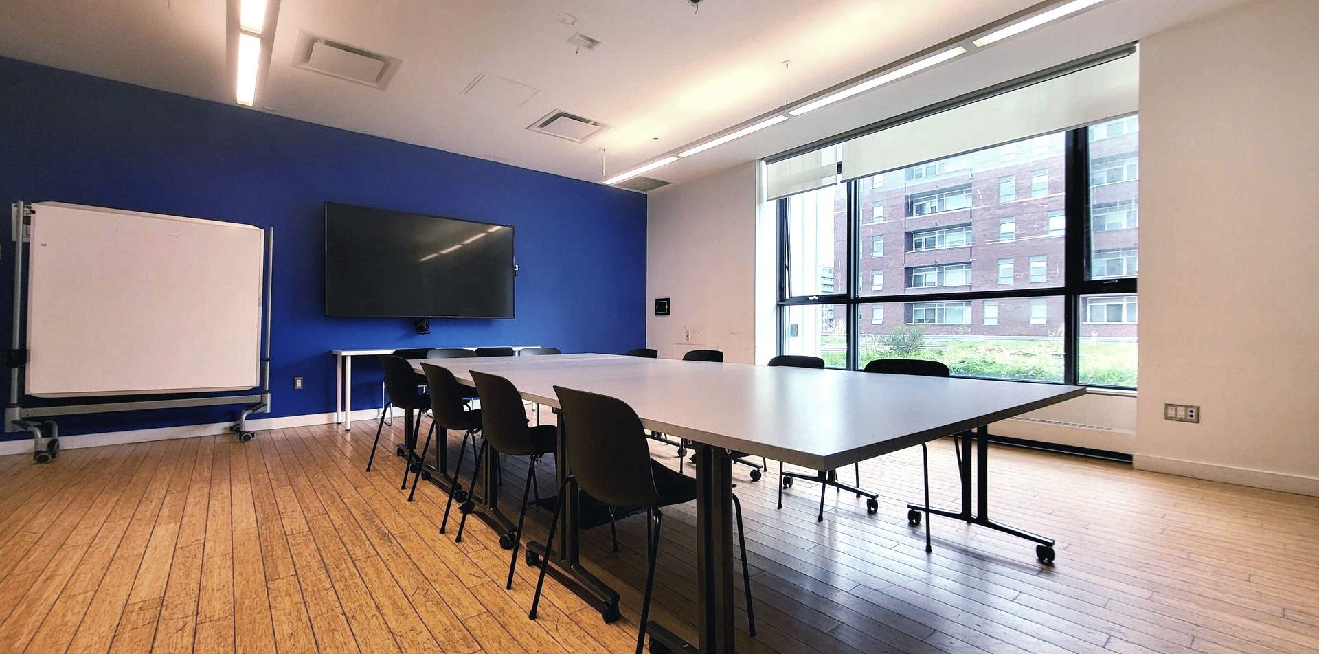 A conference room with a long table and chairs