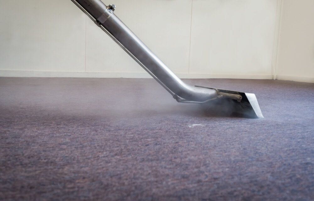Steam Cleaner Nozzle on a Carpet, Emitting Vapor — Cleanaroo Services in Conder, ACT