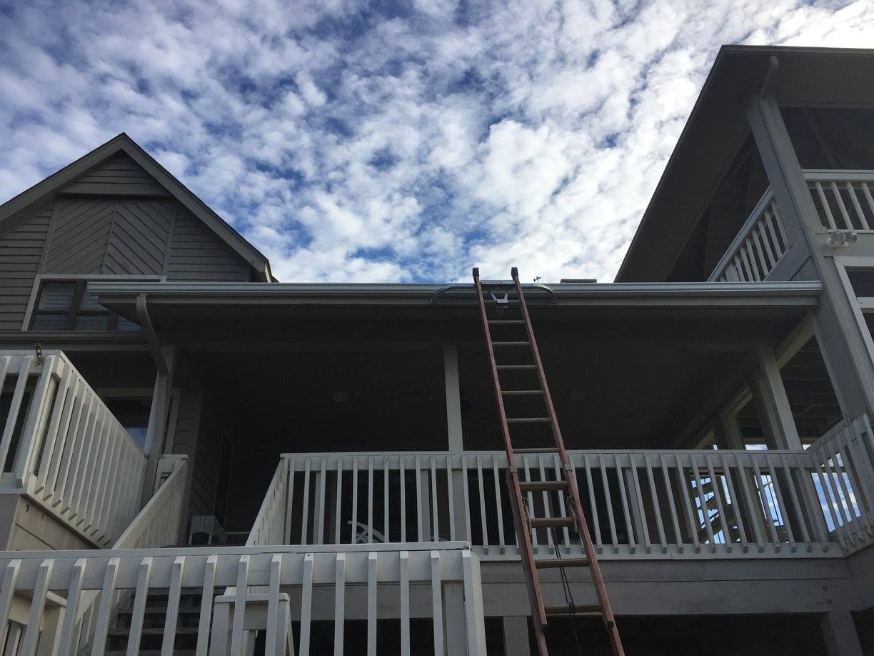 A house with a ladder on the side of it